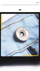 Macro view of light blue denim waist with metal zipper and vintage JEANS button detailing