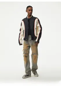 Detailed view of men's distressed straight-leg denim jeans with heavy localized wear