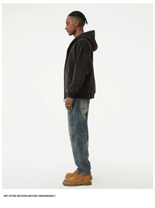 Full view of men's vintage washed blue jeans with oversized pockets and work boots