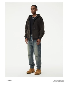 Full body view of vintage washed cargo jeans with double knee structure and retro style