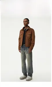 Full view of men's vintage washed straight leg jeans styled with a brown suede jacket
