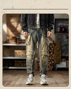 Detail view of vintage washed cargo jeans with contrast stitching and multi-pocket design