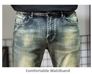 Detailed close-up of retro washed denim jeans featuring a comfortable waistline and metal button