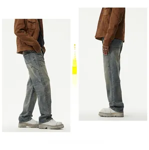 Retro washed blue men's straight overalls jeans styled with brown jacket and white boots