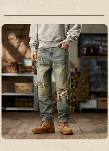 Close-up of distressed vintage denim texture with heavy wash finish and ripped fabric details