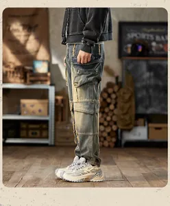 Close-up of distressed cargo jeans featuring multi-pocket design and metal zippers