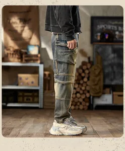 Detail of vintage blue multi-pocket cargo jeans with distressed textures and patchwork