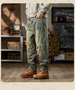 Close-up of American vintage distressed denim with heavy wash and patchwork details