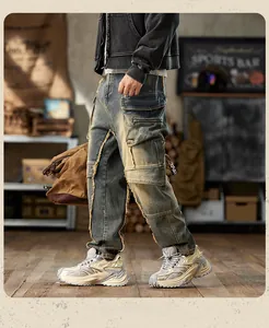 Detail of vintage washed carpenter jeans with cargo pockets and raw edge stitching