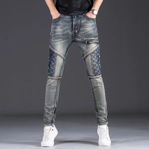 Men's slim fit patchwork denim jeans in vintage blue with distressed textures