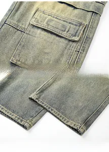 Macro shot of vintage washed denim jeans featuring large cargo pockets and hem details