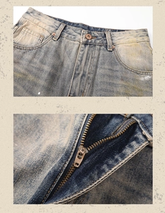 Close-up of vintage blue washed jeans with metallic YKK zipper and button details