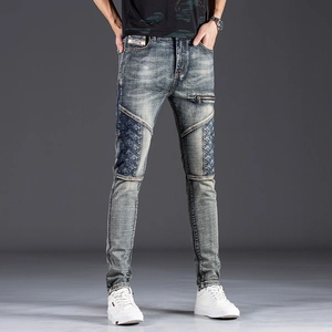 Slim fit men's patchwork jeans in deep blue wash with embroidery and zipper details