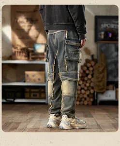Detailed back view of vintage-wash multi-pocket cargo jeans with distressed denim finish