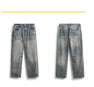 Detail of vintage blue straight-leg jeans featuring double knee panels and workwear rivets