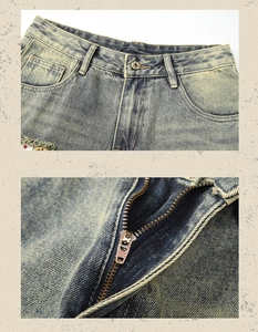 Detailed macro view of American vintage distressed denim shorts with YKK metal zipper