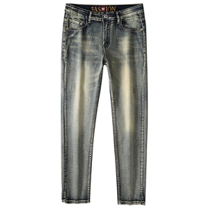 Men's slim straight vintage denim jeans in deep blue with heavy wash and whiskering details