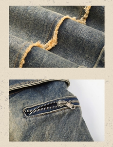 Detail of vintage blue denim fabric with distressed frayed edges and metal zipper pocket