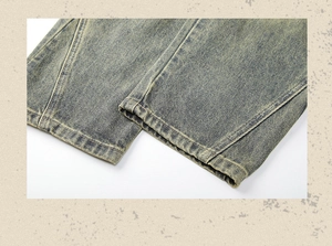 Close-up of retro washed yellow-green denim jeans hem showing distressed details and texture