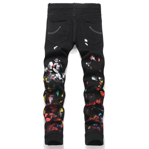 Men's slim-fit black ripped jeans with street-style paint splatter and back embroidery