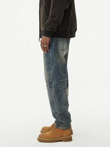 Vintage wash loose denim pants for men featuring cargo pockets and distressed details