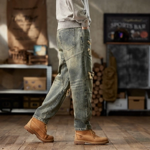 Men's retro distressed baggy jeans with ripped repair details in vintage washed finish
