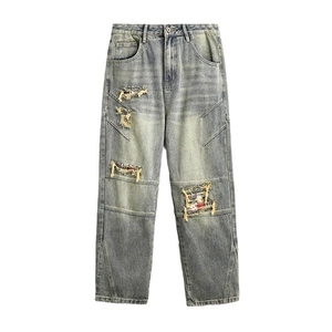 Men's loose distressed light blue jeans with vintage American patchwork ripped details
