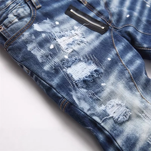 Men's blue slim fit punk distressed jeans with paint splatter and zipper detail