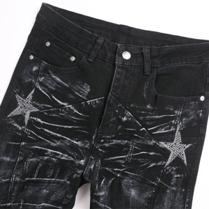 Slim fit black flare jeans for men with star patches and distressed vintage wash