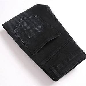Slim fit black flare jeans for men with vintage sandblasted texture and sturdy denim fabric