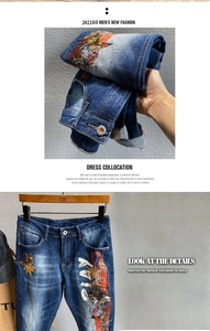 Detailaufnahme der Herren-Slim-Fit-Jeans mit kunstvoller Bestickung und Streetstyle-Prints