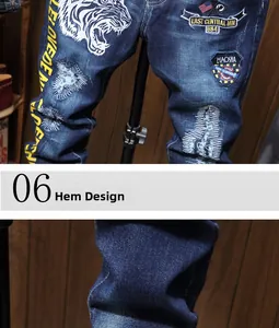 Detail of tiger embroidery and vintage patches on American retro distressed denim jeans