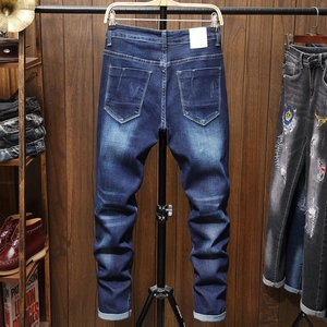 Men's slim fit dark blue washed jeans with vintage whiskers and embroidered pockets