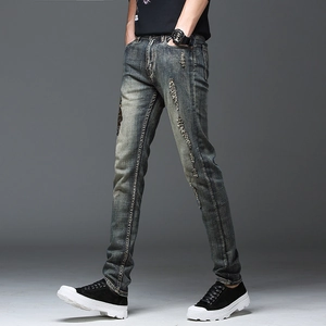 Jean slim pour hommes en délavage gris-bleu vintage avec broderies et détails usés
