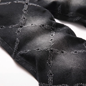 Men's punk black denim jeans with washed texture and beaded cross patchwork detail