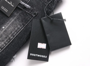 Detail of New Rider Jean denim showing black brand tag and long crotch tight bottom fit