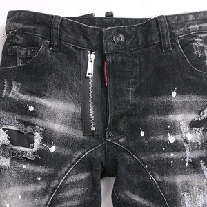 Deep grey distressed stretch slim jeans with ripped details and metallic zip decor