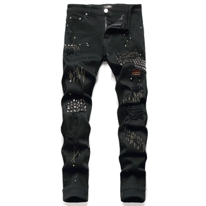 Men's slim black distressed jeans with rivets, embroidery patches and paint splatter