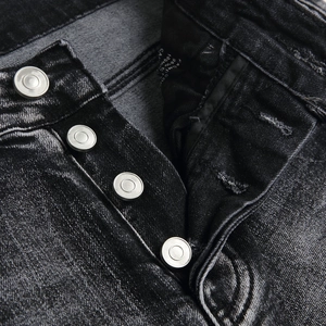 Mens black washed slim fit flare jeans with high-quality button fly and vintage texture