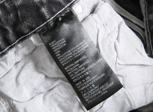 Detailed view of the internal wash label showing 100% cotton and cashmere blend material