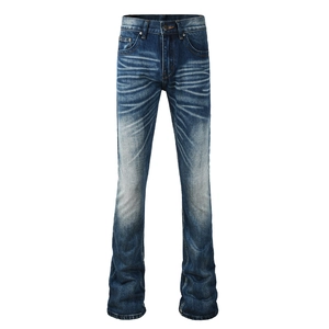 Detailed macro view of dark blue denim jeans with vintage whiskering and washing effects