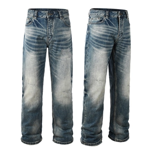 Classic loose straight-leg men's jeans in blue wash with vintage whisker texture