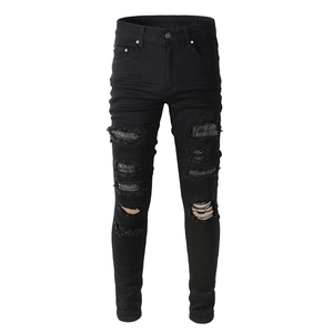 Men's slim fit black distressed jeans with sparkling rhinestone mesh inner patches