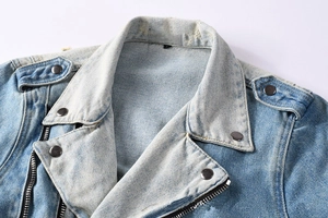 Detail view of American vintage light blue denim jacket with heavy wash and metal zipper