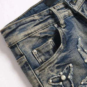 Jean évasé bleu slim pour homme avec délavage vintage et broderie papillon en perles