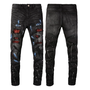 Slim fit black washed jeans for men with distressed holes and red rhinestone patches