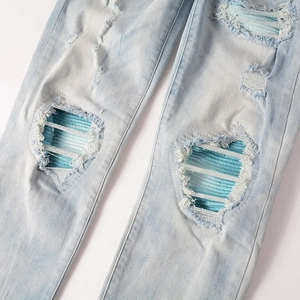 Men's slim fit distressed blue jeans with ripped knee and blue striped patch detail