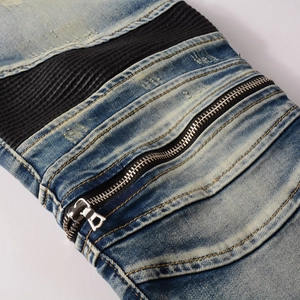 Men's light blue biker jeans featuring ribbed panels and decorative metal zippers