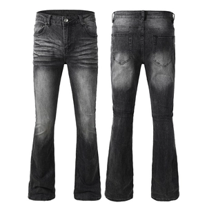 Détails du jean évasé gris noir délavé vintage avec boutons métalliques et effet moustaches