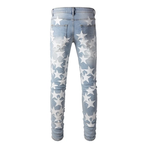 Slim fit light blue denim jeans for men with white star patches and high-street style